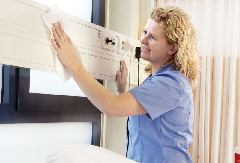 Woman cleaning with S.U.D.S. cloth.